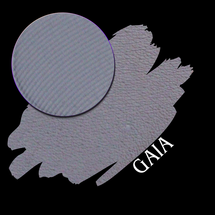 A swatch on a black background, with a circular makeup eyeshadow pan and the name 'GAIA' printed in white near the lower right.
