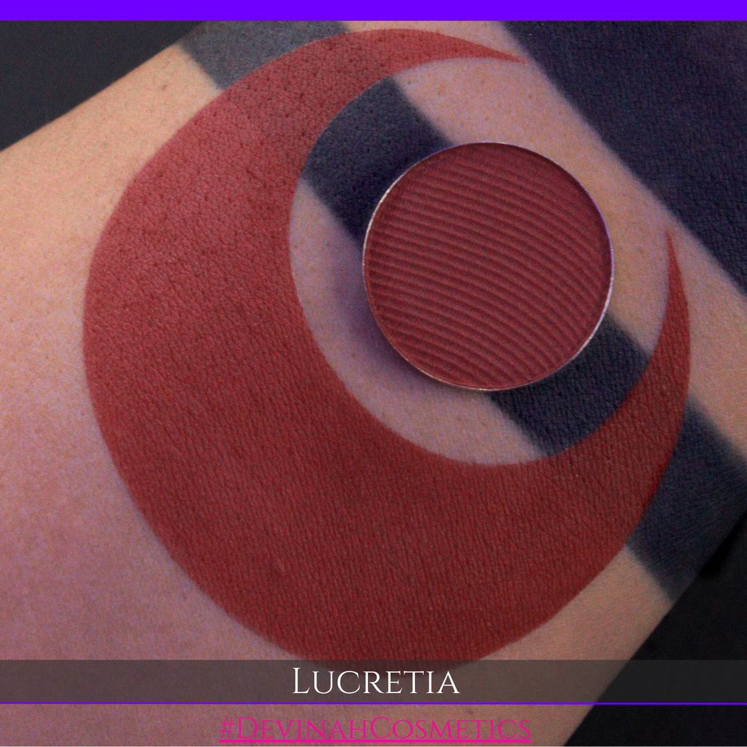 Close-up of a makeup product with 'Lucretia' branding on a patterned background