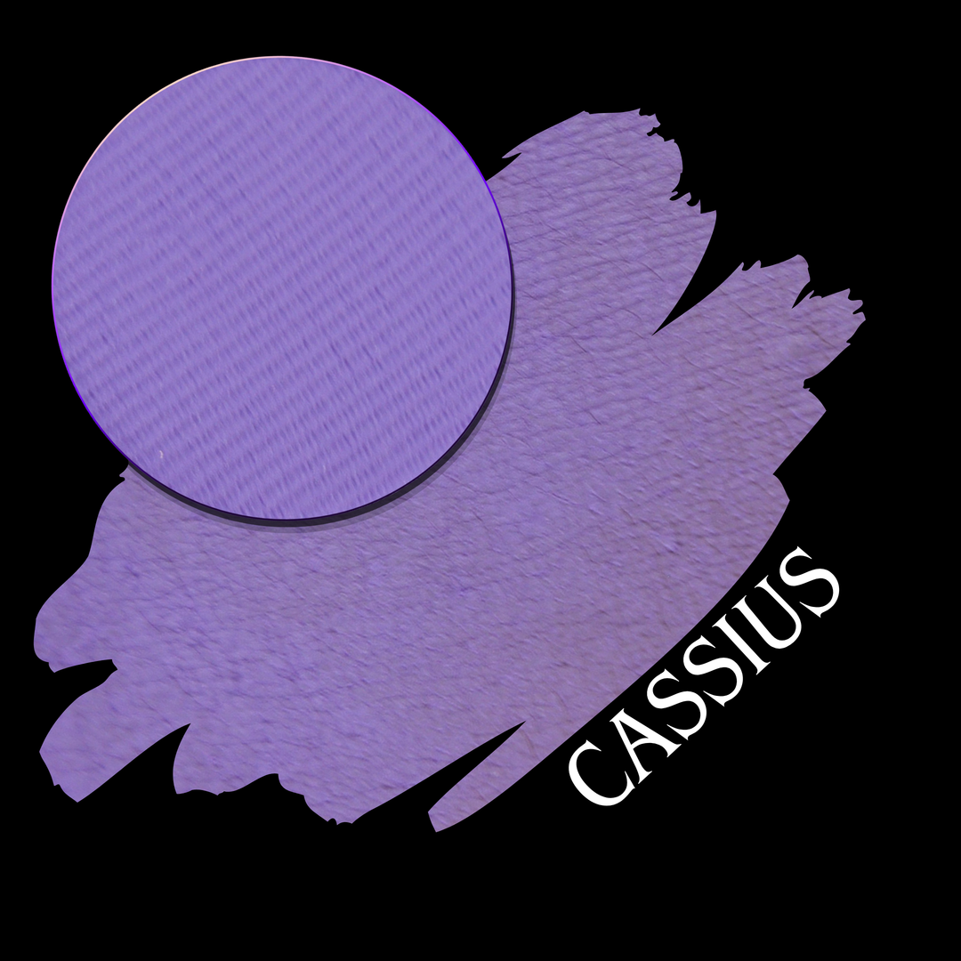 A purple eyeshadow swatch with a circular eyeshadow makeup pan, labeled 'CASSIUS' in white text on a black background