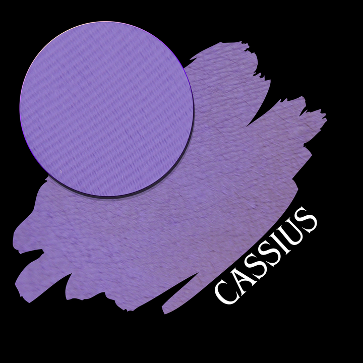A purple eyeshadow swatch with a circular eyeshadow makeup pan, labeled 'CASSIUS' in white text on a black background
