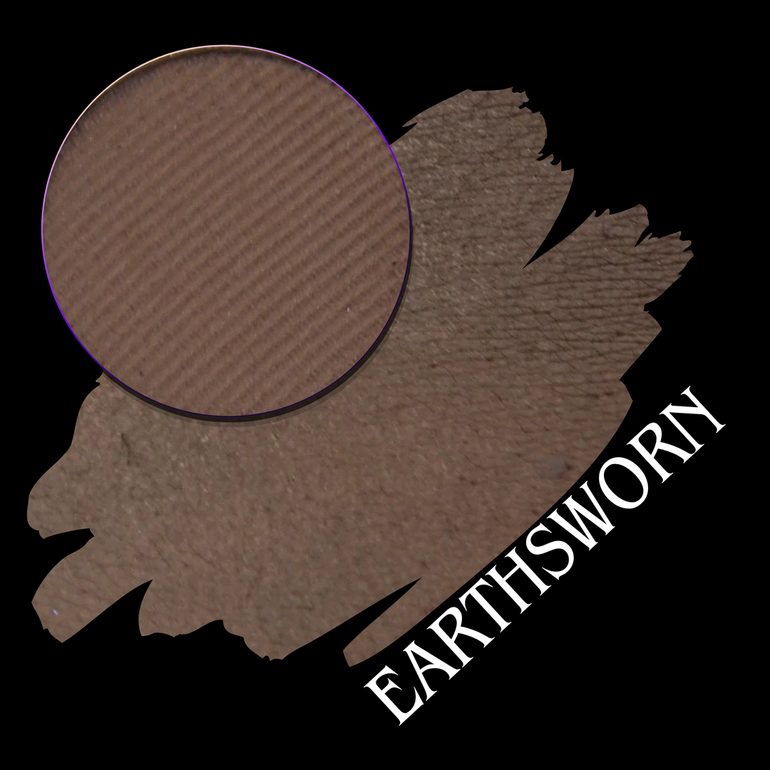 A makeup swatch showing a brown eyeshadow with a circular eyeshadow makeup pan, labeled 'EARTHSWORN' on a black background.