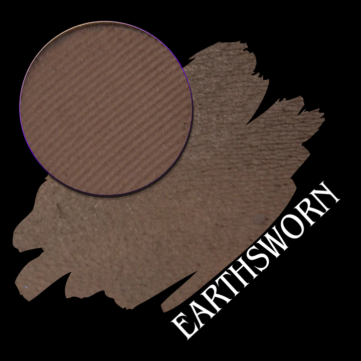 A makeup swatch showing a brown eyeshadow with a circular eyeshadow makeup pan, labeled 'EARTHSWORN' on a black background.