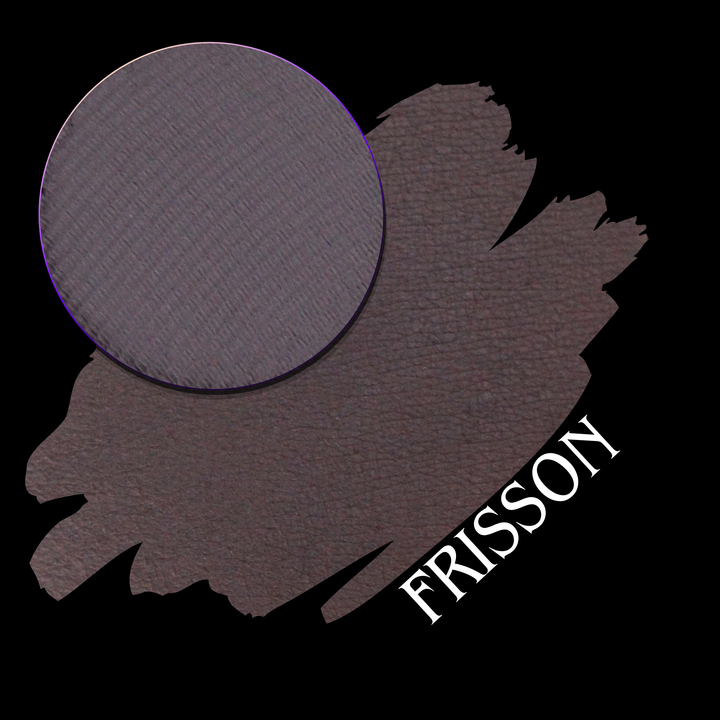 A circular eyeshadow pan of dark mauve-brown matte pigment over a matching swatch on a black background, with the word 'FRISSON' in white on the lower corner