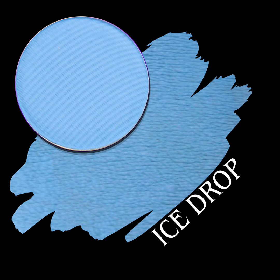 A circular makeup eyeshadow pan of a light icy blue matte pigment shown over a matching swatch on a black background, with the text 'ICE DROP' in white at the lower right.