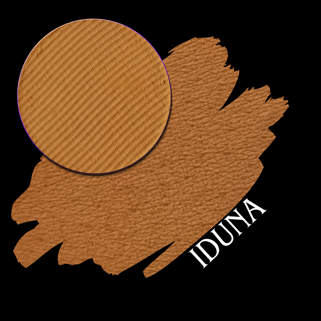 A makeup swatch showing a warm medium brown matte with a circular eyeshadow pan on a black background, labeled 'IDUNA' in white text.