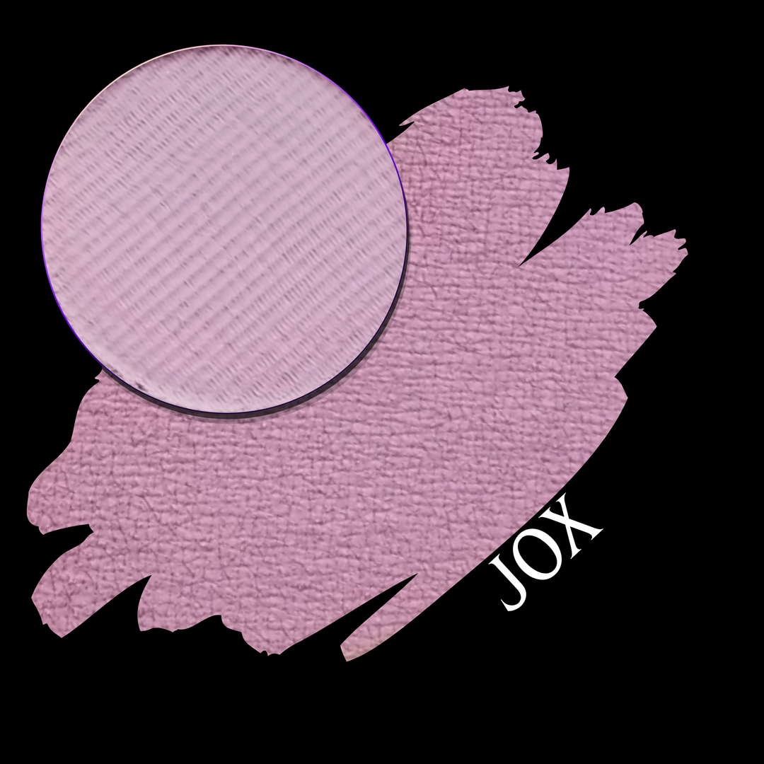 A soft pink swatch with a circular makeup eyeshadow pan of matte pigment, labeled 'JOX' in white text on a black background.
