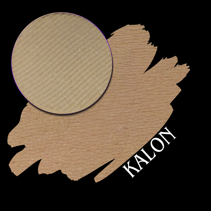 A circular makeup eyeshadow pan showing a light tan shade, placed over a swatch on a black background, with the word 'KALON' in white text.