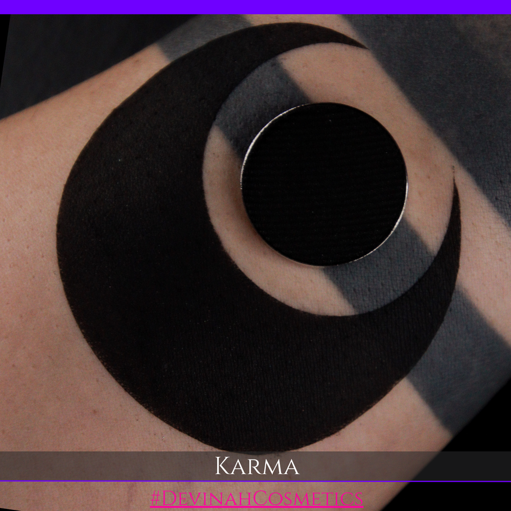 Black circular tattoo on skin with 'Karma' brand name at the bottom.