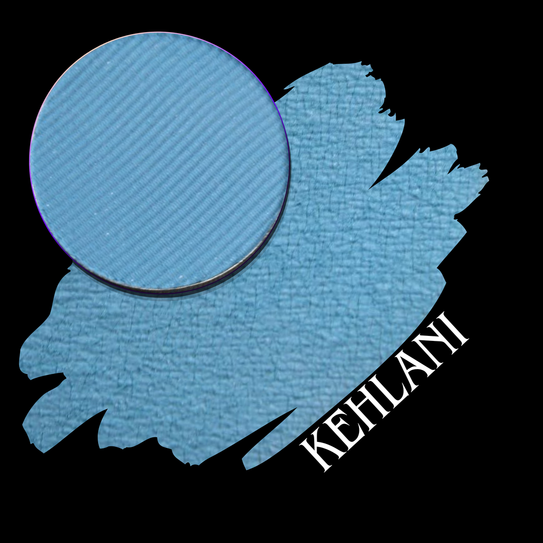 A circular makeup eyeshadow pan in a light sky blue shade is shown with a swatch on a black background, with the name KEHLANI in white text.