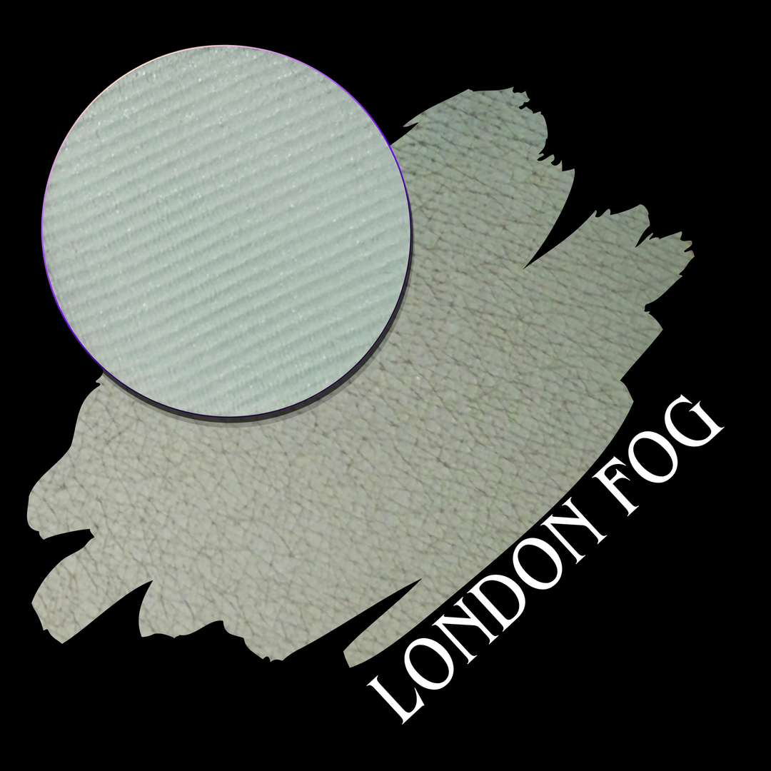 A swatch with a circular eyeshadow makeup pan on a black background, with the text 'LONDON FOG' in white at the bottom right.