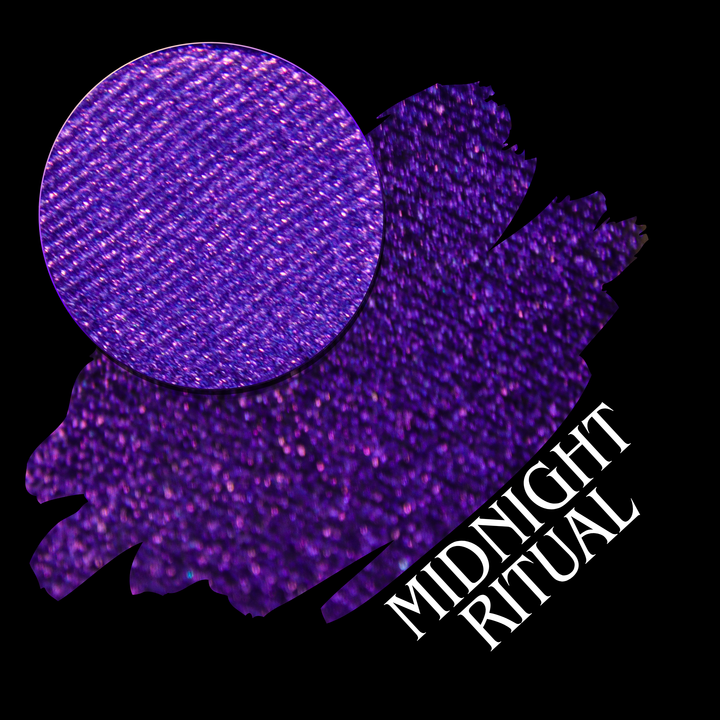 A close-up swatch of sparkly purple pigment, shown over a larger matching purple swatch on a black background with the text 'MIDNIGHT RITUAL' in white made by Devinah Cosmetics.