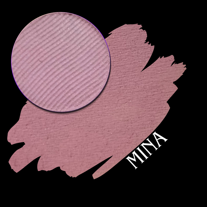 A makeup color swatch showing a circular pressed powder pan over a larger swatch of the same dusty mauve-pink shade, with the name 'MINA' in white text on a black background.