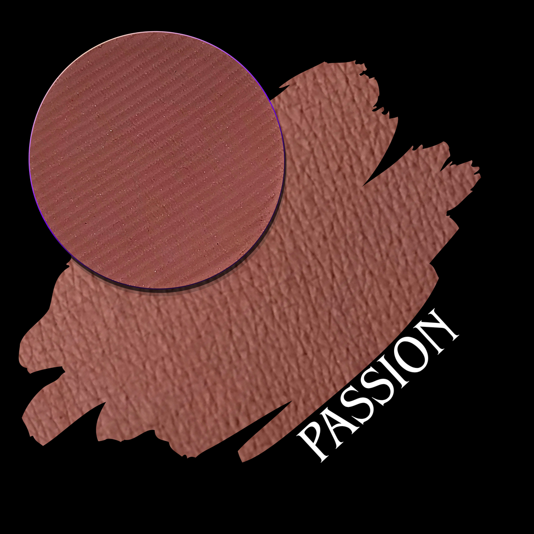 A makeup swatch showing a warm dusty rose or mauve-brown shade with a circular eyeshadow matte pressed powder pan and labeled 'PASSION' on a black background.