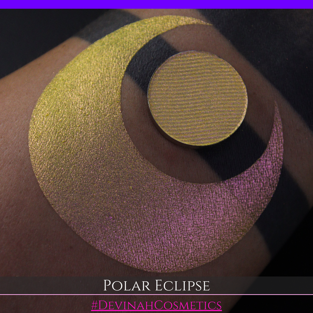 A close-up of a swatch and a circular  shimmering eyeshadow pan in a yellow-to-iridescent pink tone. Text at the bottom reads 'POLAR ECLIPSE' and '#DEVINAH Cosmetics'.