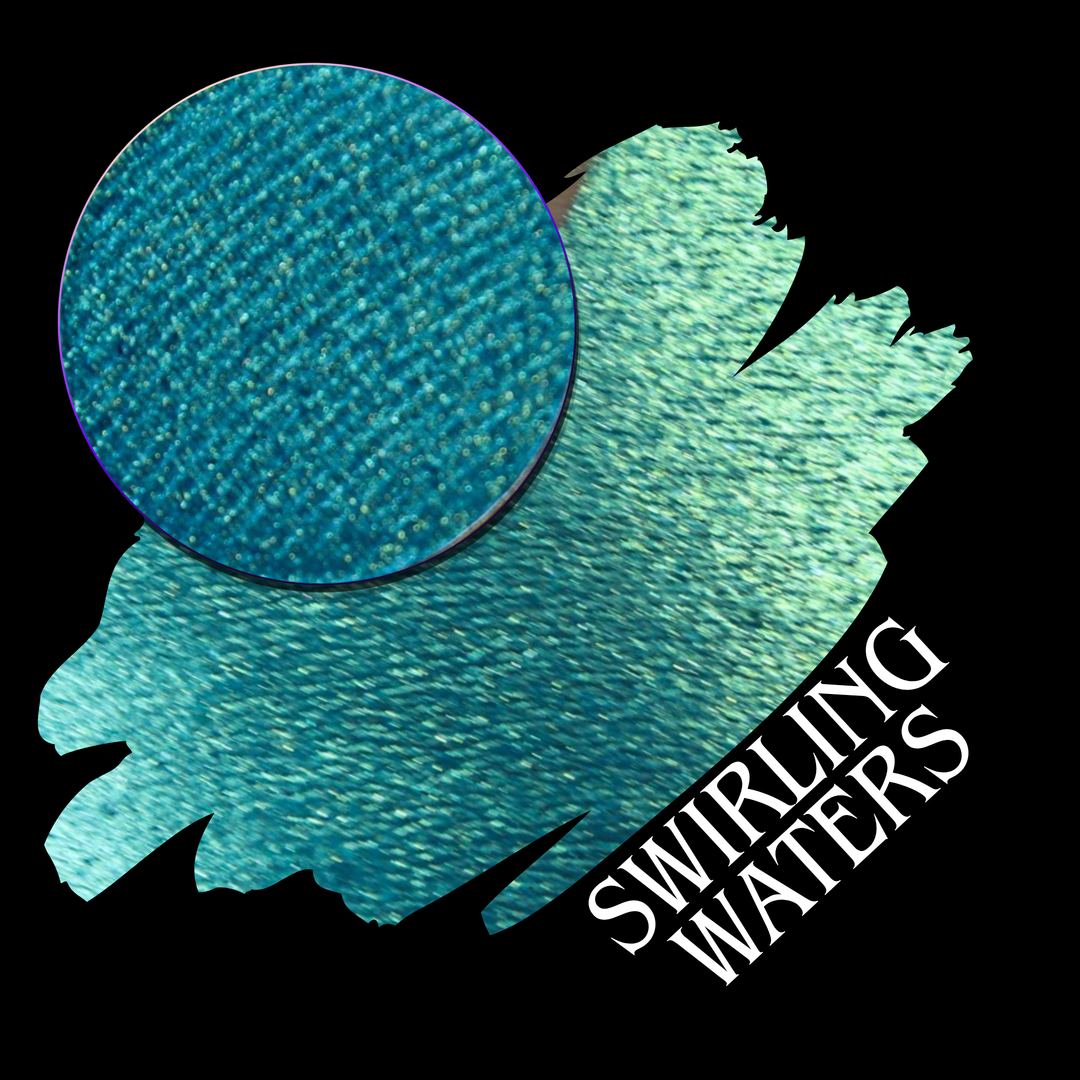 A round eyeshadow pan labeled 'SWIRLING WATERS' made by Devinah Cosmetics, placed over a large crescent moon swatch of the same shimmering shifty eyeshadow on skin. The eyeshadow has a duochrome multichrome shift between colors teal, blue, green.
