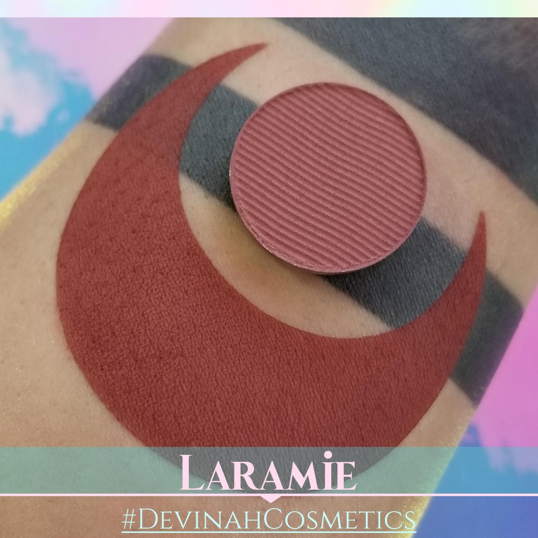 Makeup product on a swatch with Laramie and Devinah Cosmetics branding.