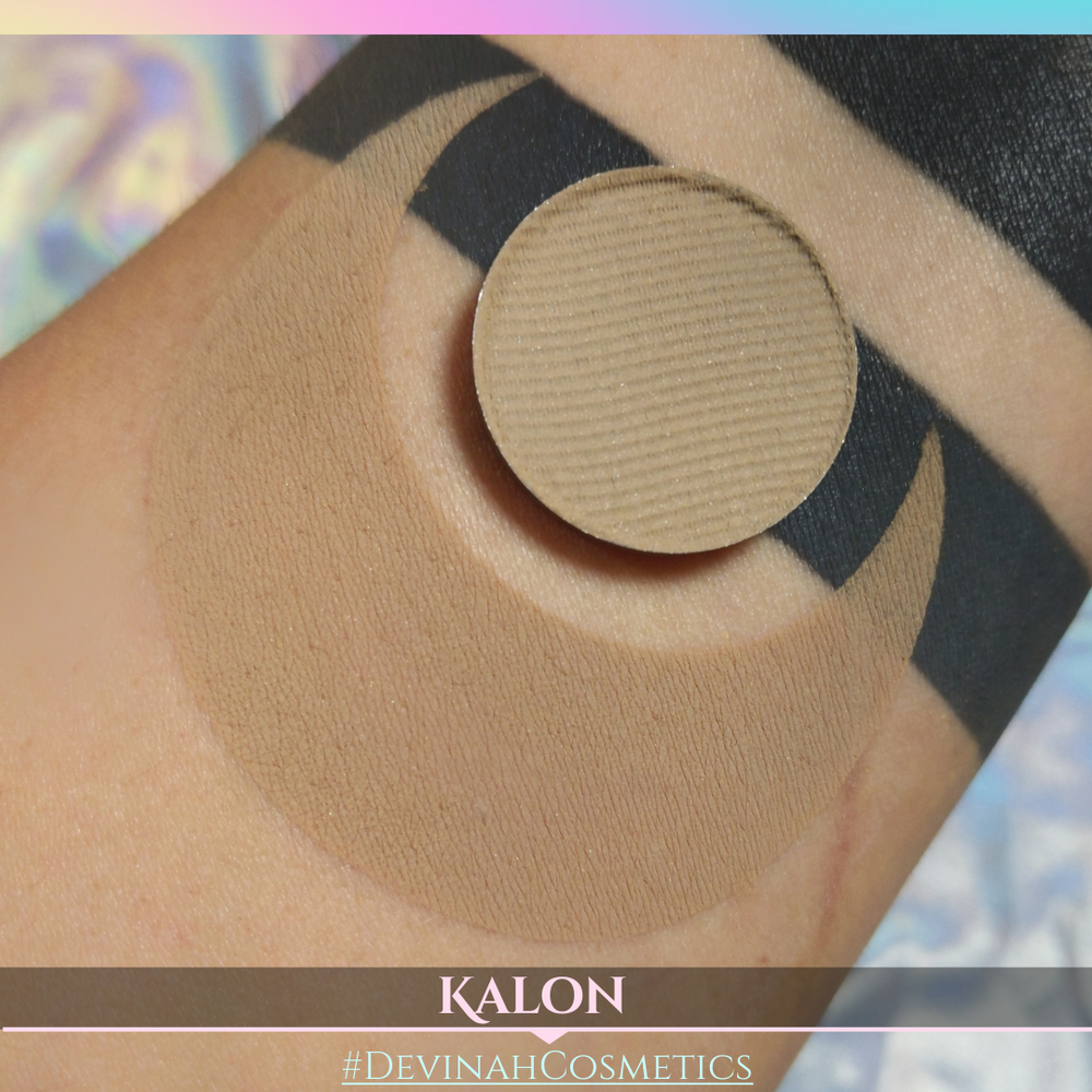 Close-up of a beige makeup product on skin with 'Kalon' branding.